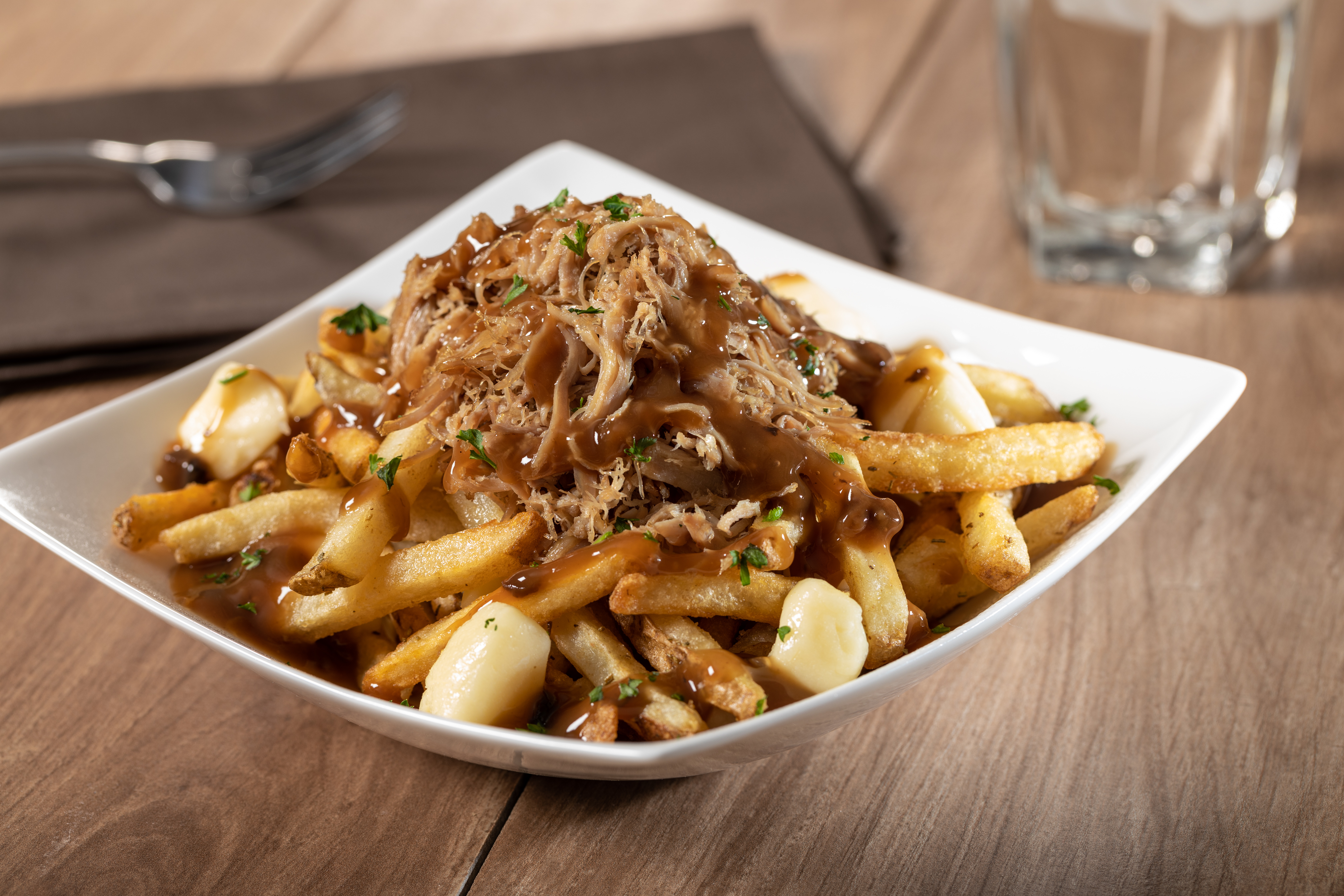 https://upperlakesfoods.com/wp-content/uploads/2023/03/Pulled-Duck-Poutine-with-Duck-Fat-Fries-Copyright-2020.jpg